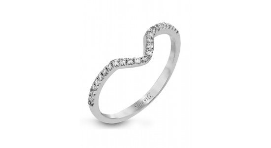 a white gold wedding band featuring diamonds and a curve to make room for an engagement ring center stone