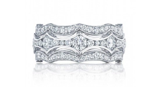 an intricately detailed white gold ring featuring diamonds of different sizes