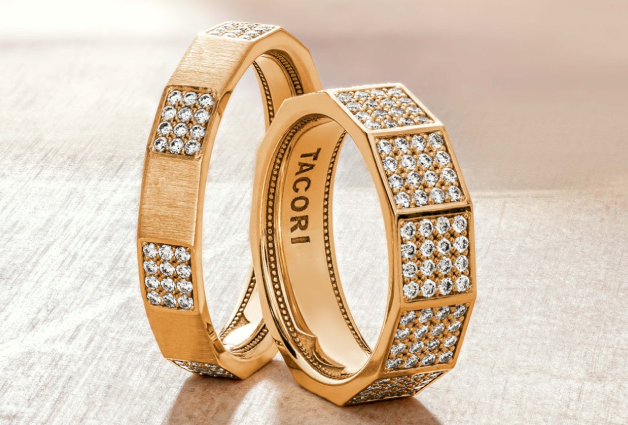 Gender neutral wedding bands by Tacori with an interesting geometric shape and multiple rows of diamonds.