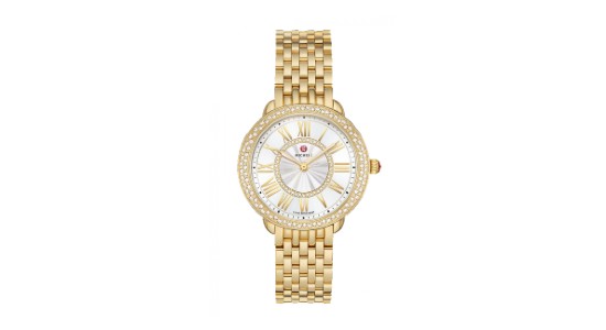 a yellow gold Michele watch featuring a row of tiny diamonds set into the bezel
