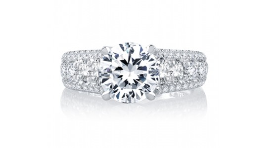 a white gold engagement ring by A.JAFFE featuring a wide, diamond studded band