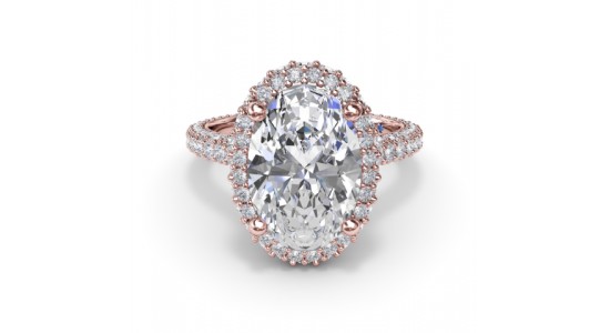 a rose gold engagement ring by Fana featuring a large oval cut center stone