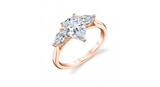 a rose gold, three stone ring by Sylvie featuring three pear shape diamonds