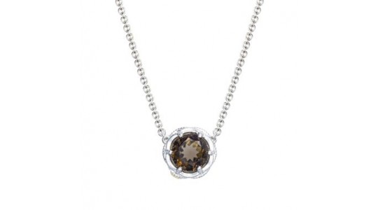 a white gold pendant necklace featuring a round cut smoky quartz