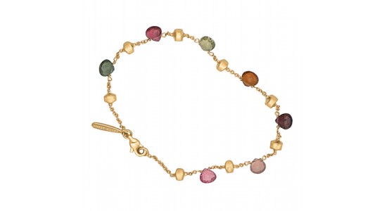 a yellow gold chain bracelet featuring a number of gemstones in different colors
