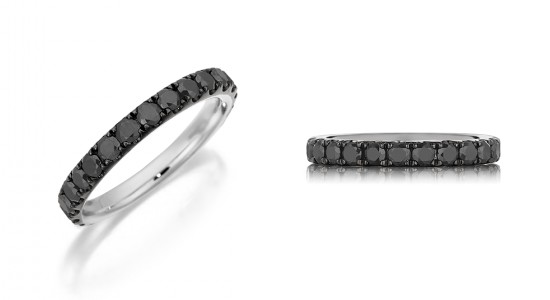 two alternative angles of a silver wedding band set with black diamonds.