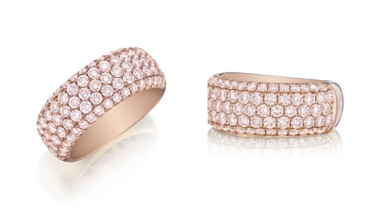 two angles of the same pink diamond and rose gold wedding band