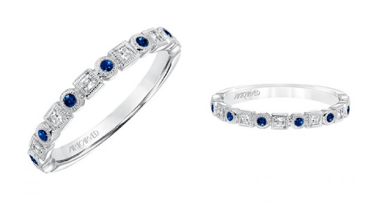 two angles of the same silver, sapphire, and diamond wedding band