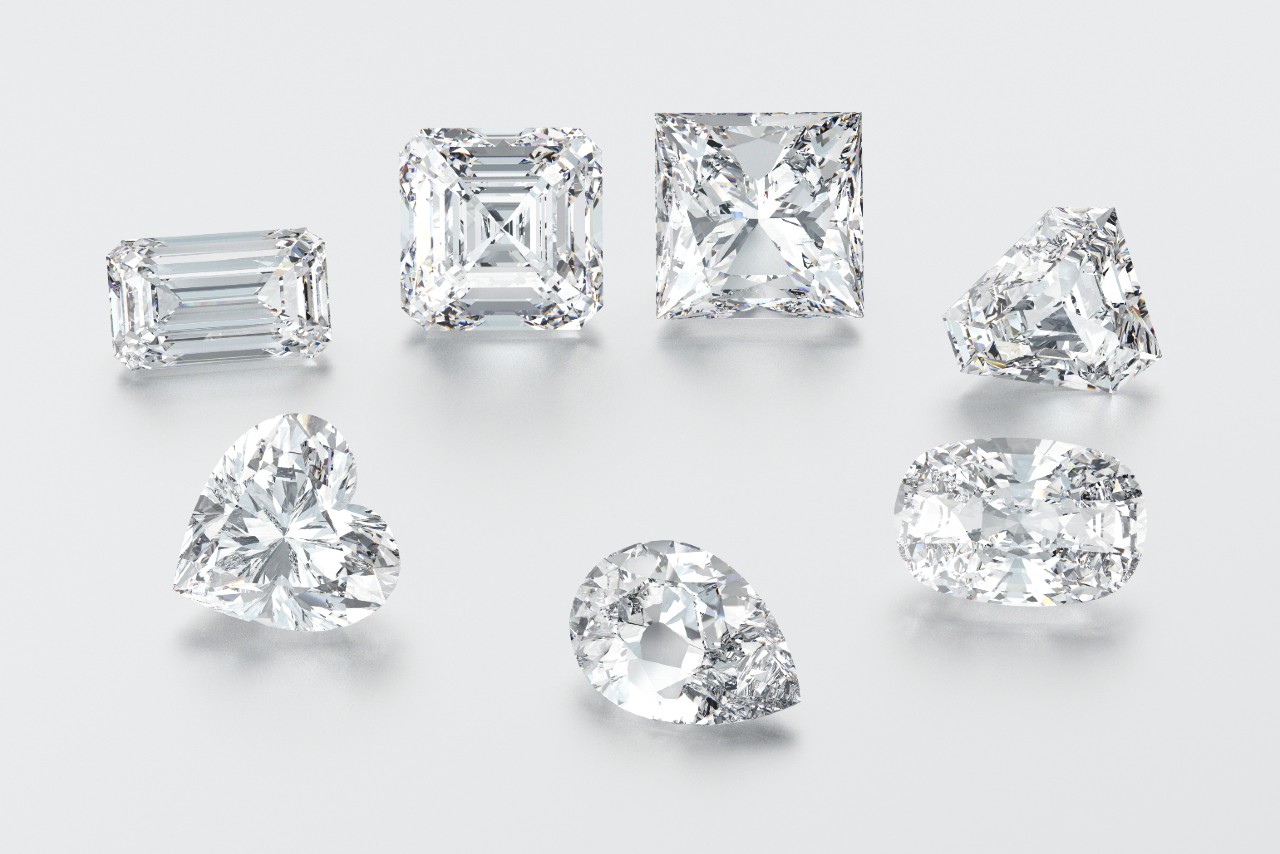 a variety of diamonds with different shapes on a gray background