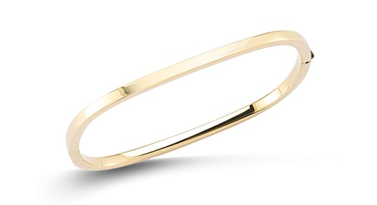 a yellow gold bangle bracelet by Roberto Coin