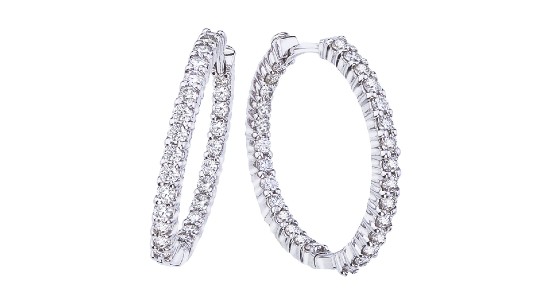 a pair of white gold hoop earrings studded with diamonds