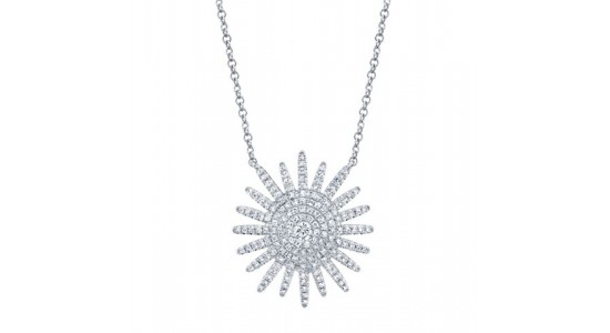 a white gold starburst necklace studded with diamonds