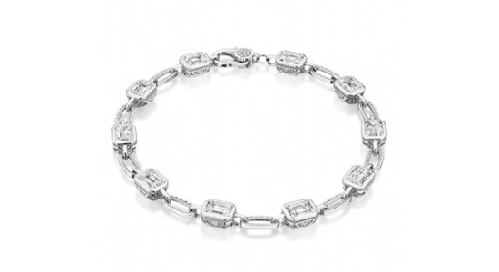 a white gold diamond line bracelet with bezel set stones