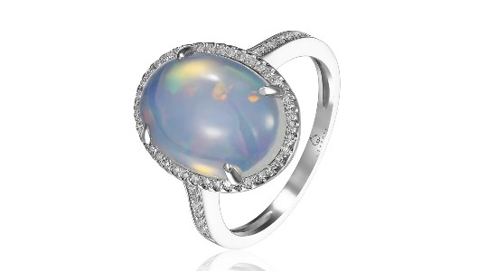 a statement ring with a halo set opal