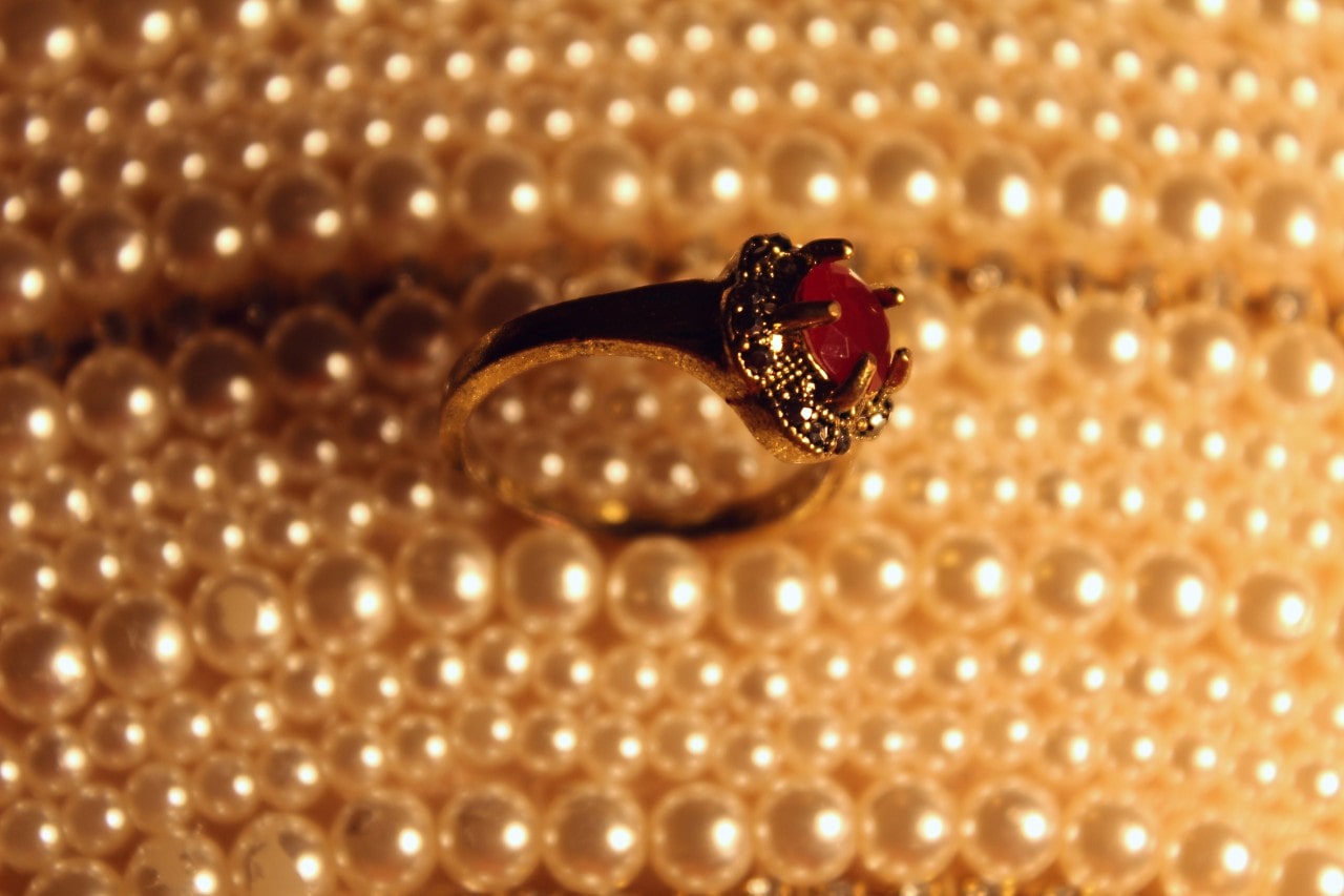 ruby fashion ring with pearl background