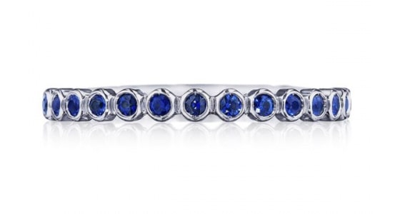 A wedding band from Tacori with bezel-set sapphires.
