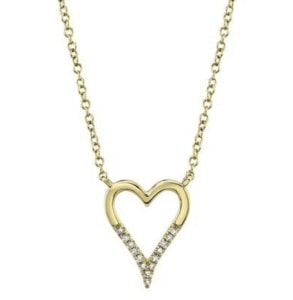 A heart-shaped pendant with diamond accents from BENARI JEWELERS’ in-house collection.