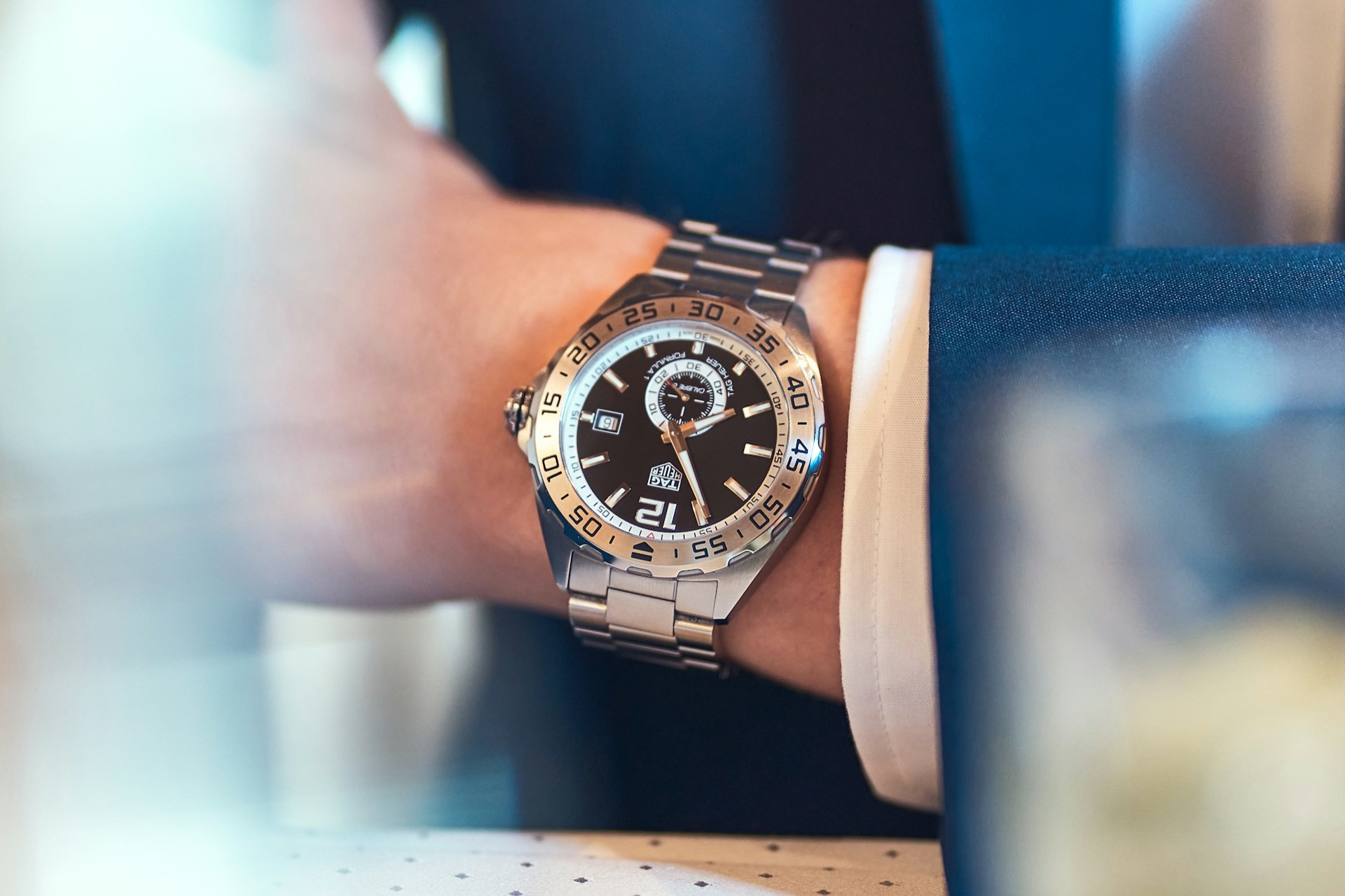 a man’s wrist wearing a TAG Heuer Formula 1 Watch