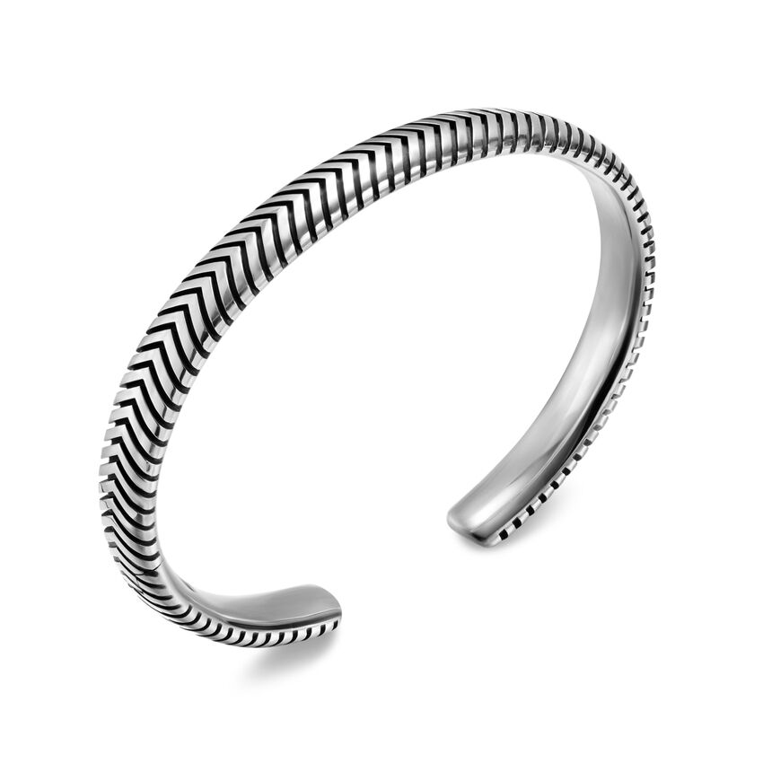 A sterling silver cuff bracelet with v-shaped pattern on a white background