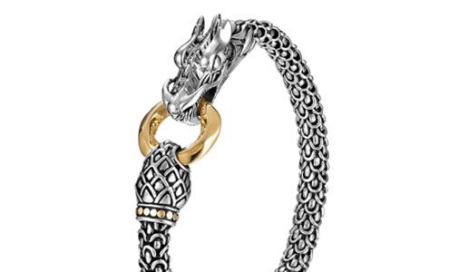 A close-up of a sculptural silver bracelet with a dragon motif from John Hardy, available at BENARI JEWELERS.