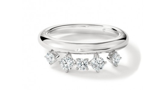 A white gold Hearts on Fire fashion ring with off-center diamond accents, available at BENARI JEWELERS.