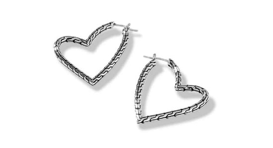 a pair of white gold hoop earrings by John Hardy shaped into a heart