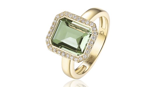 a yellow gold fashion ring featuring a green gemstone and a diamond halo