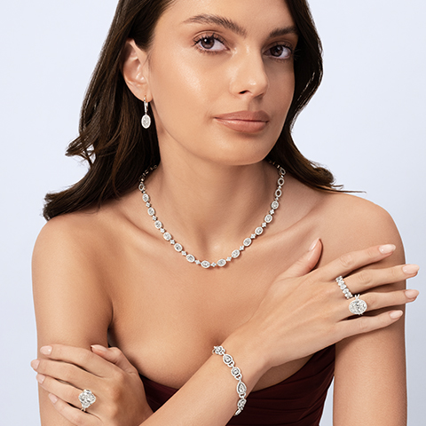 Shop Uneek Bridal - featuring a woman wearing Uneek bridal jewelry